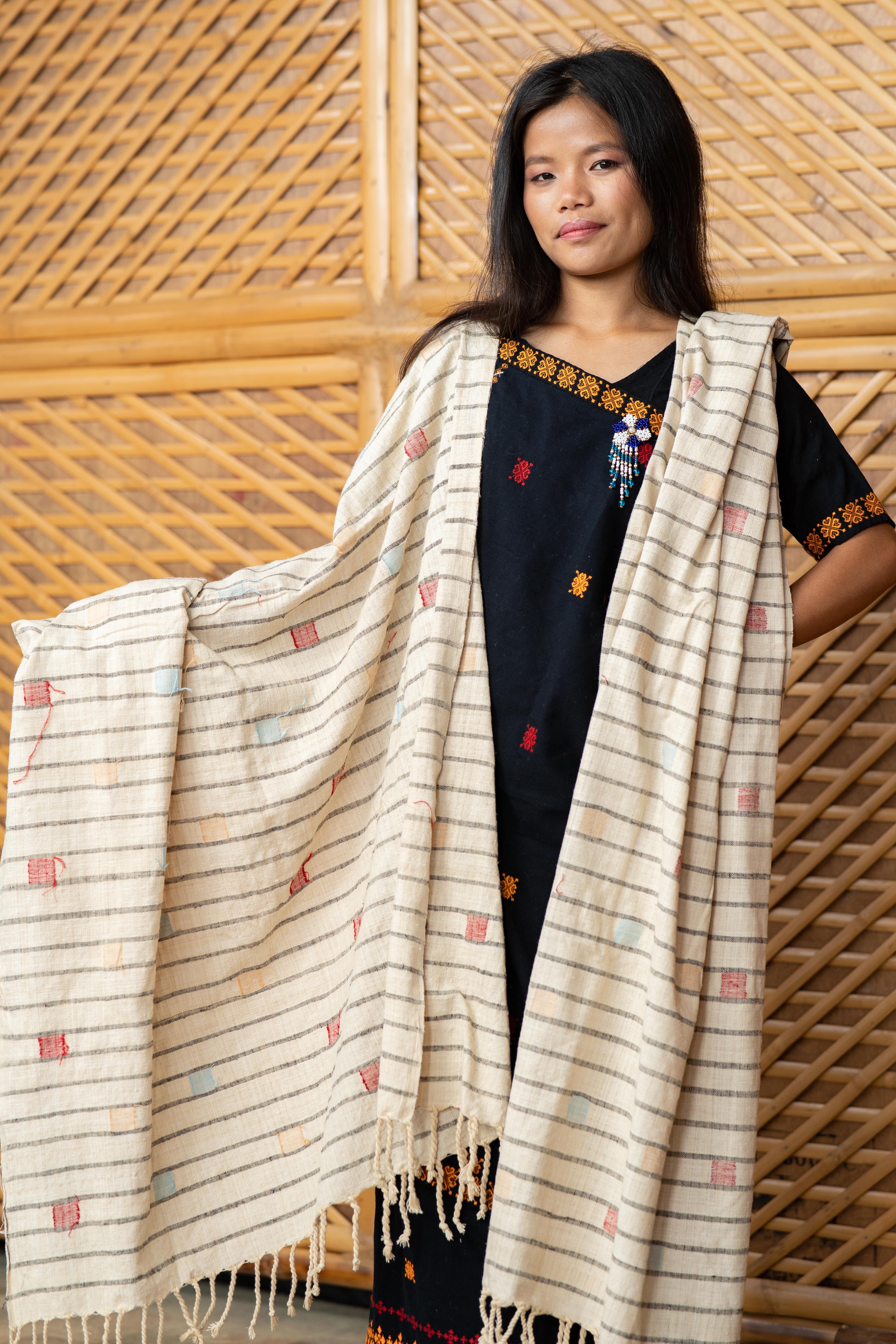 Artisan displaying handwoven Eri silk shawl